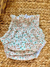 Cubrepañal con estampado de flores verde agua y mostaza Eucalipto
