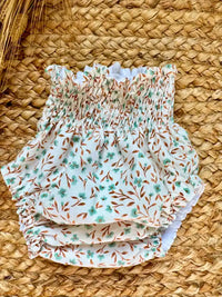 Cubrepañal con estampado de flores verde agua y mostaza Eucalipto