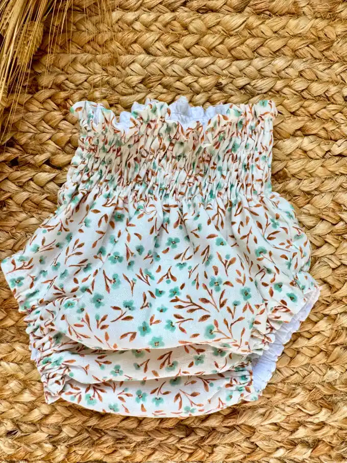 Cubrepañal con estampado de flores verde agua y mostaza Eucalipto
